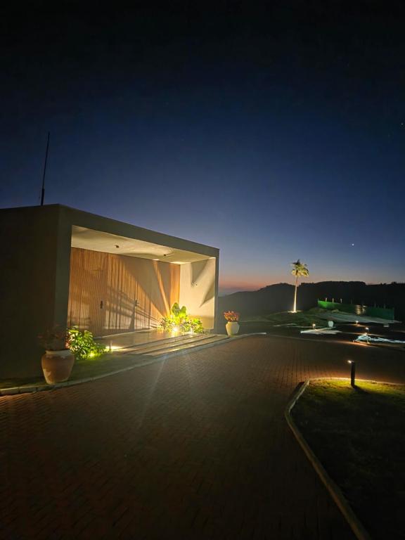 a large building at night with lights on it at Vinicola Spirito in Espirito Santo Do Pinhal