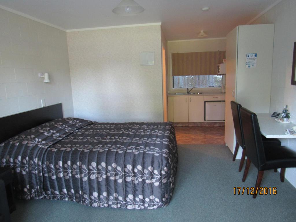 Postel nebo postele na pokoji v ubytování Matador Motel