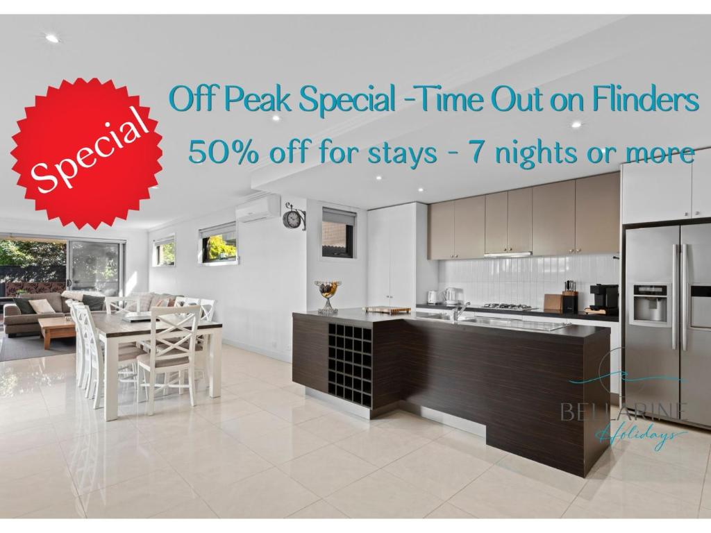 a kitchen with a counter and a dining room at Time Out on Flinders in Indented Head