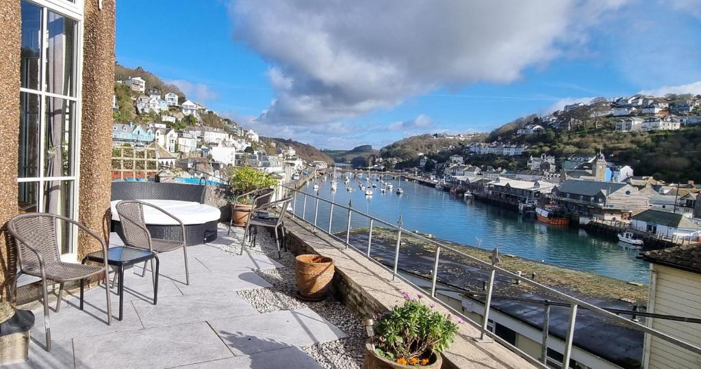 a balcony with a view of a river at Albany in Looe