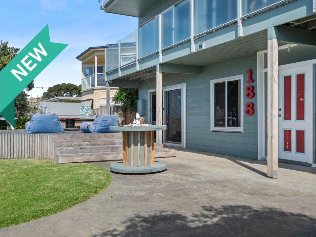 a building with a table in front of it at Esplanade Escape in Indented Head