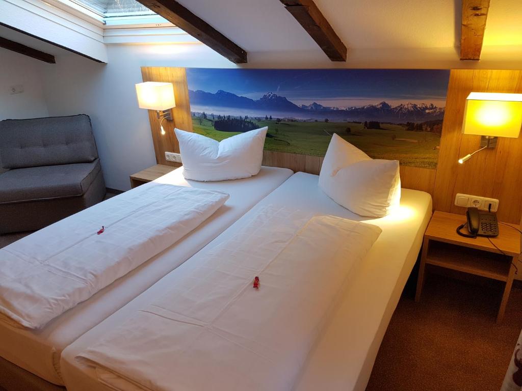 Postel nebo postele na pokoji v ubytování Hotel Ruchti - Zeit für mich