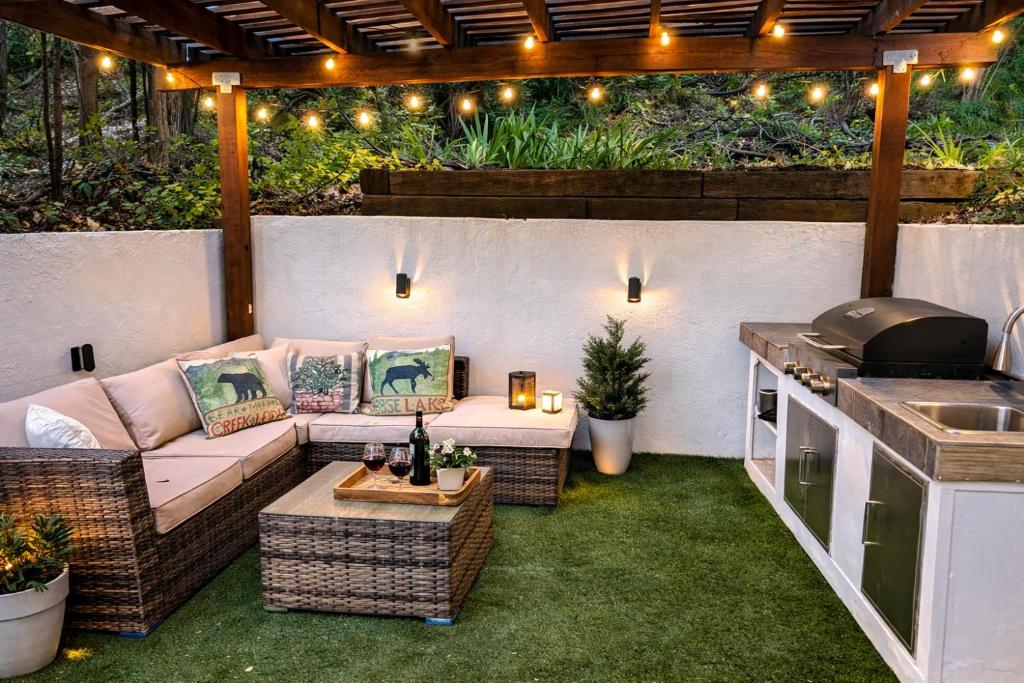 a patio with a couch and a table and a grill at Dunsmuir Getaway in Dunsmuir