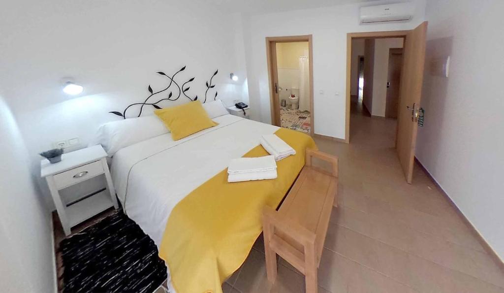 Postel nebo postele na pokoji v ubytování Hostal Aquaforum
