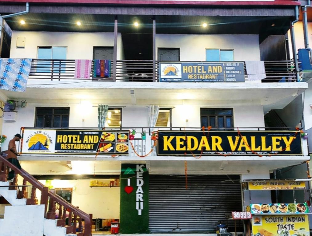 a building with a keeder valley sign on it at Kedar velley in Phata