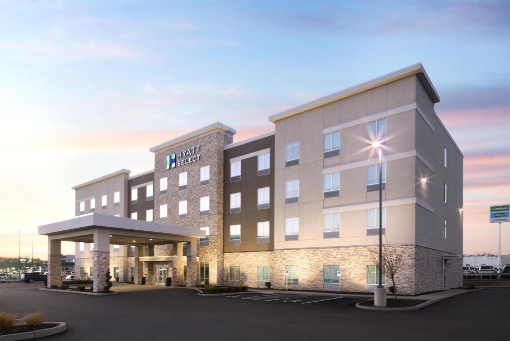 a rendering of a hotel building with a parking lot at Hyatt Select St Louis Airport in Saint Louis