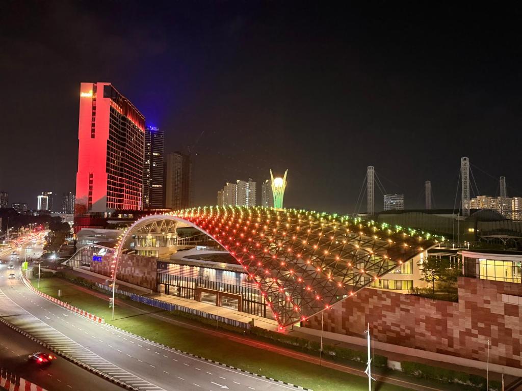 a building with an arch with lights on it at SPICE Skyview Luxe Tunas 3B2B in Relau