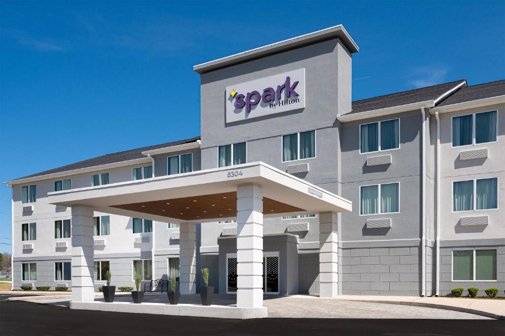 a rendering of a hotel building with a parking lot at Spark by Hilton Douglasville Atlanta West in Douglasville