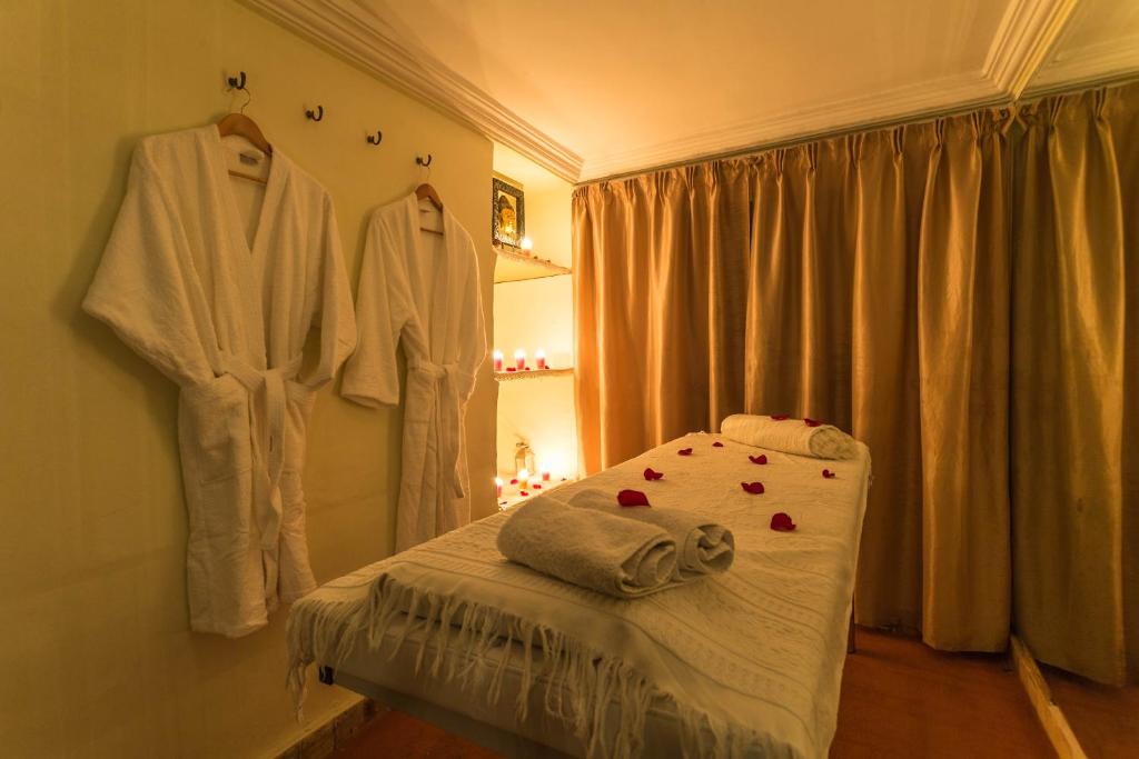 Postel nebo postele na pokoji v ubytování Riad Nasreen