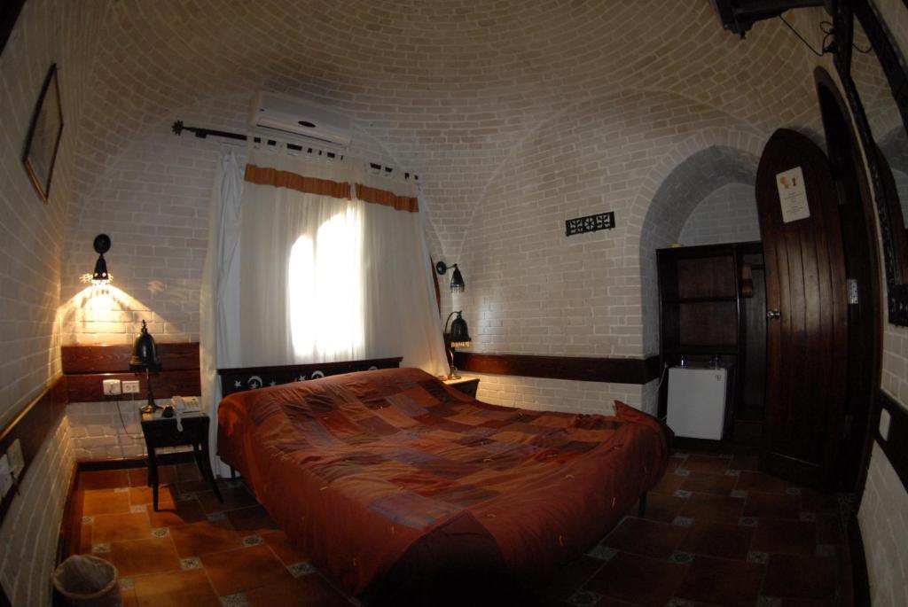 A bed or beds in a room at Nesima Resort