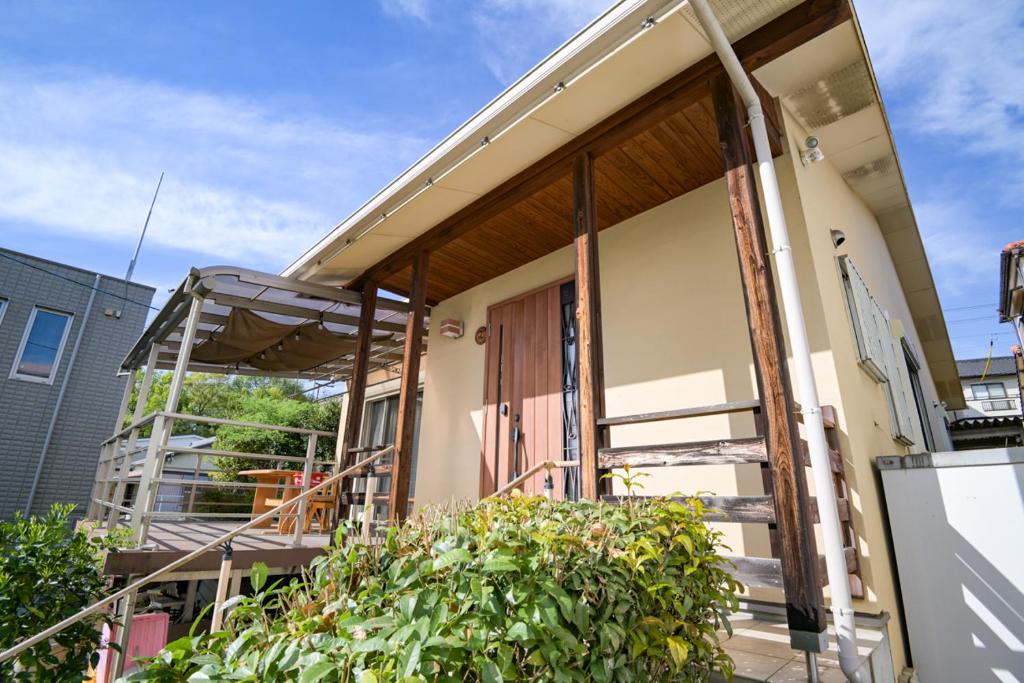a house being remodeled with the front door open at 民泊 丘の上 in Seto