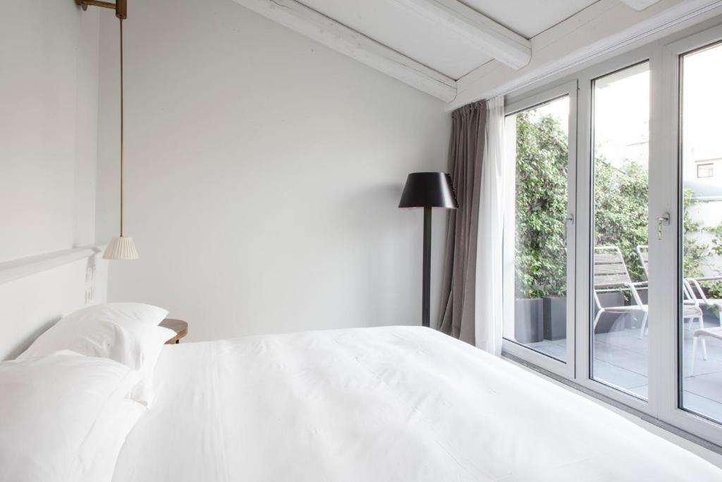Postel nebo postele na pokoji v ubytování Senato Hotel Milano