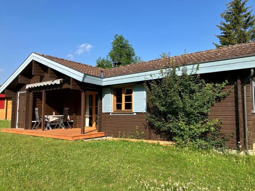 a small house with a porch and a patio at Ferienhaus Neckar 43 in Hayingen
