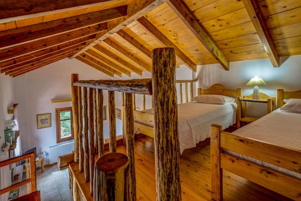 Postel nebo postele na pokoji v ubytování Manoli's House