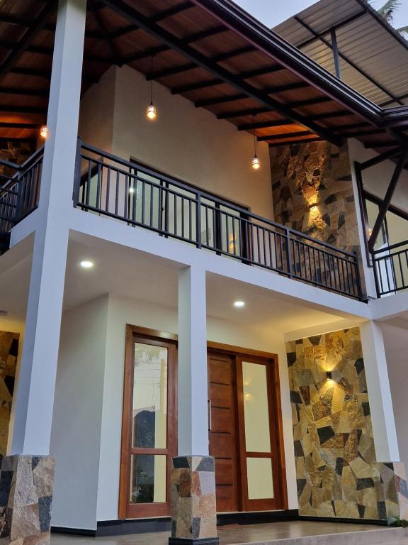an image of a house with a balcony at OASIS Victoria Lounge! in Kandy