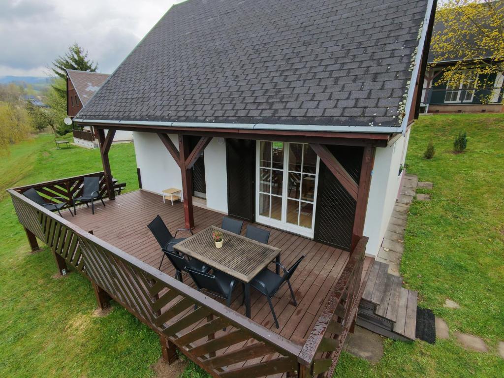 an overhead view of a house with a wooden deck at Chata Větrník u Černého dolu v Krkonoších in Lauterwasser