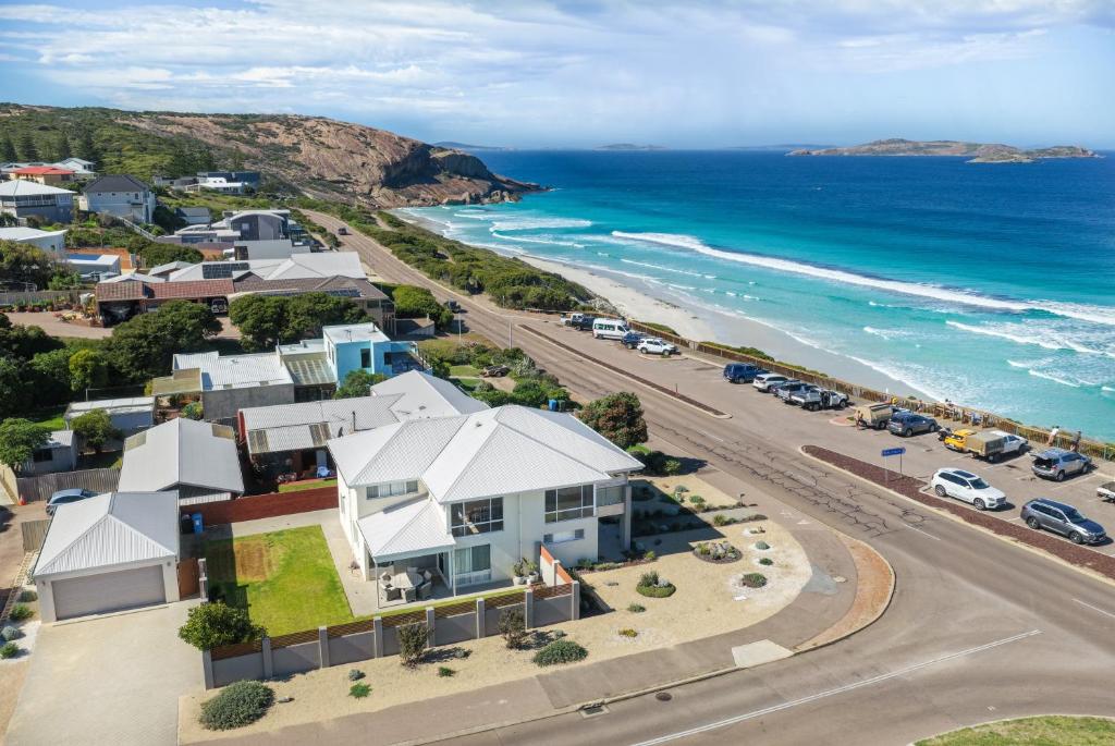 an aerial view of a beach with houses and the ocean at West Beach House in Esperance
