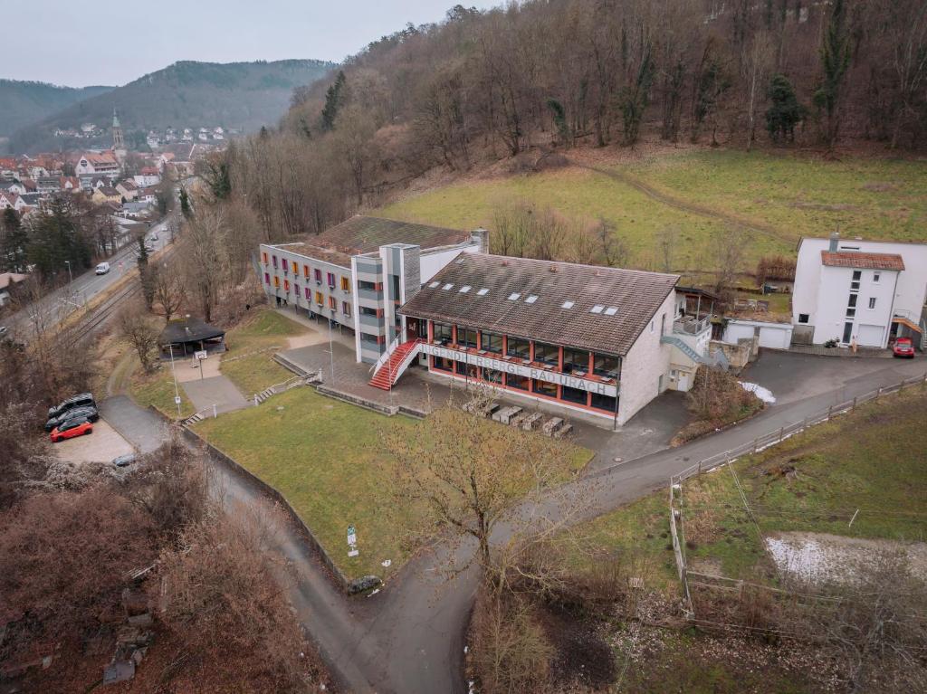 an aerial view of a building on a hill at Jugendherberge Bad Urach in Bad Urach