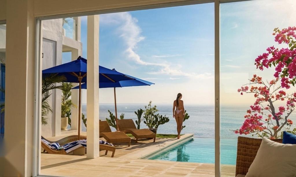 a villa with a view of the ocean at NEW! 3BR Ocean View, Infinity Pool, Villa Helios in Sampalan