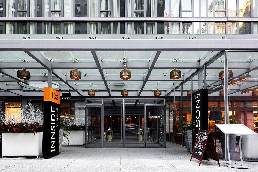 an entrance to a building with a glass ceiling at INNSiDE by Meliá New York Nomad in New York