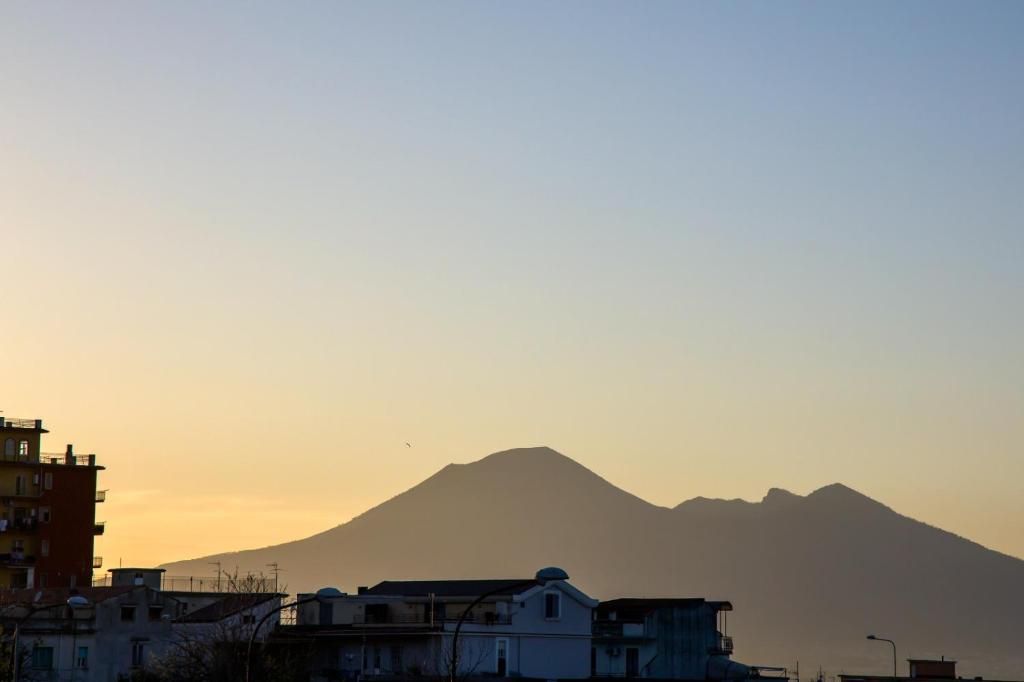 a mountain in the background of a city with buildings at Way to Coast in Sant'Egidio del Monte Albino