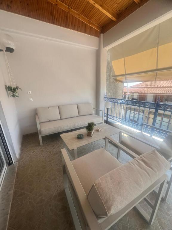 a living room with a couch and a table at Seaside Apartment in Vergia in Vergia