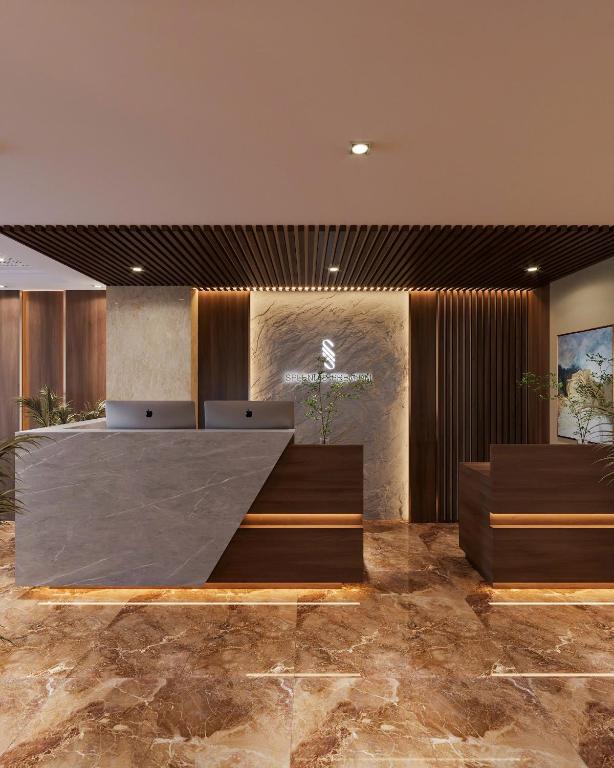 a lobby with a ramp in the middle of a room at Splendid Star Suite Hotel in Hanoi
