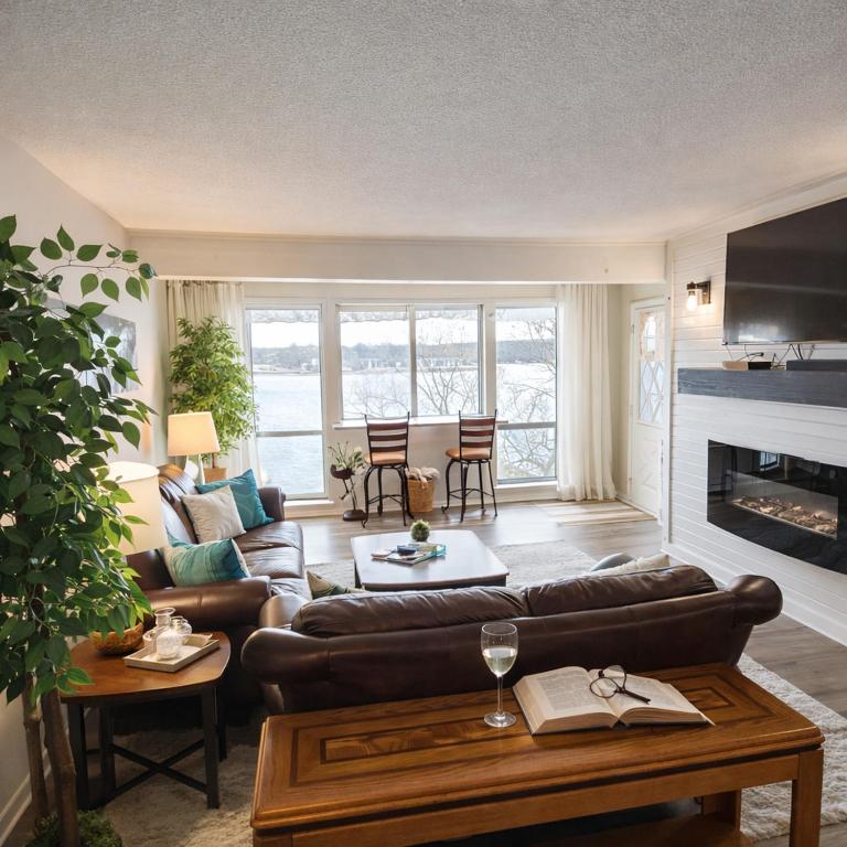 a living room with a couch and a table at Tranquil Retreat - Close to everything you need in Osage Beach