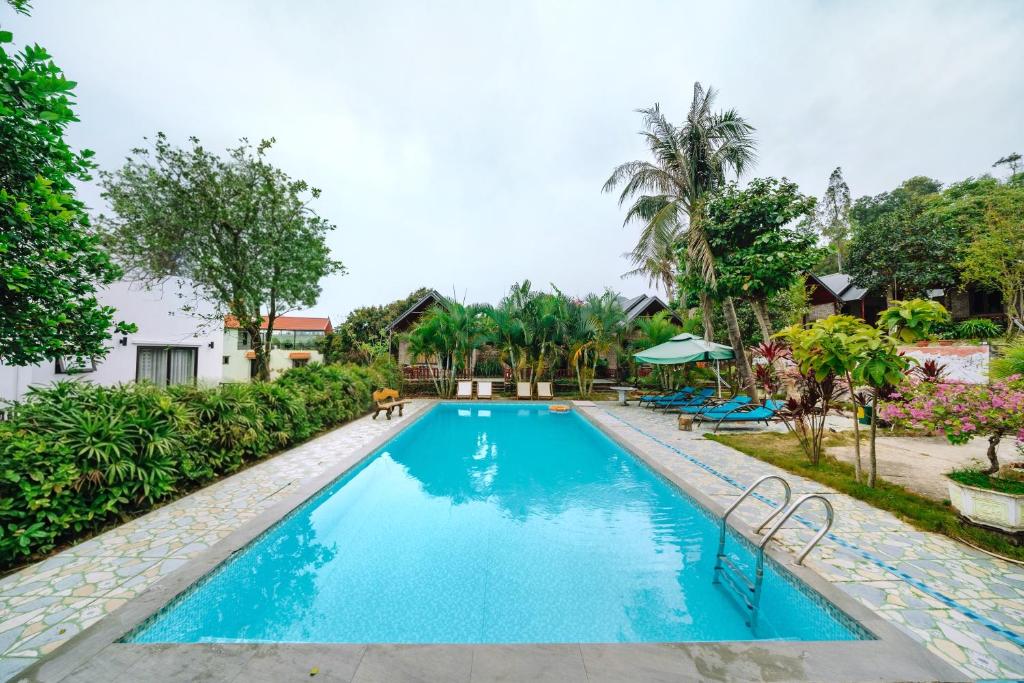 an image of a swimming pool at a resort at Cat Ba Spring Homestay in Cat Ba