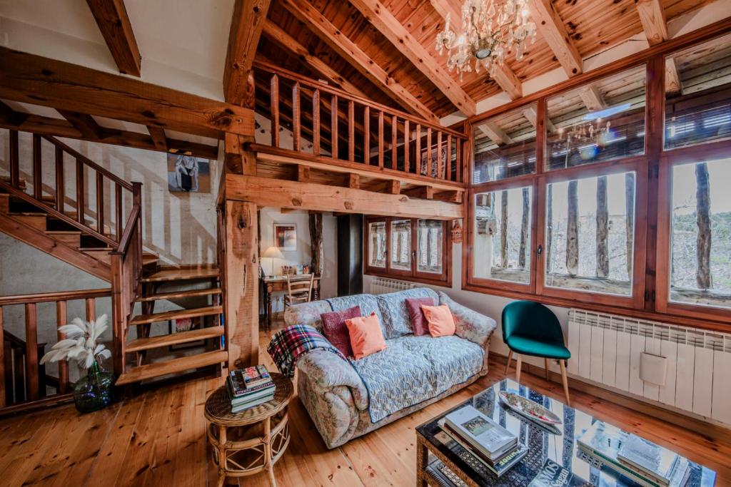 a living room with a couch and a table at Casona del Tambor in Calatañazor