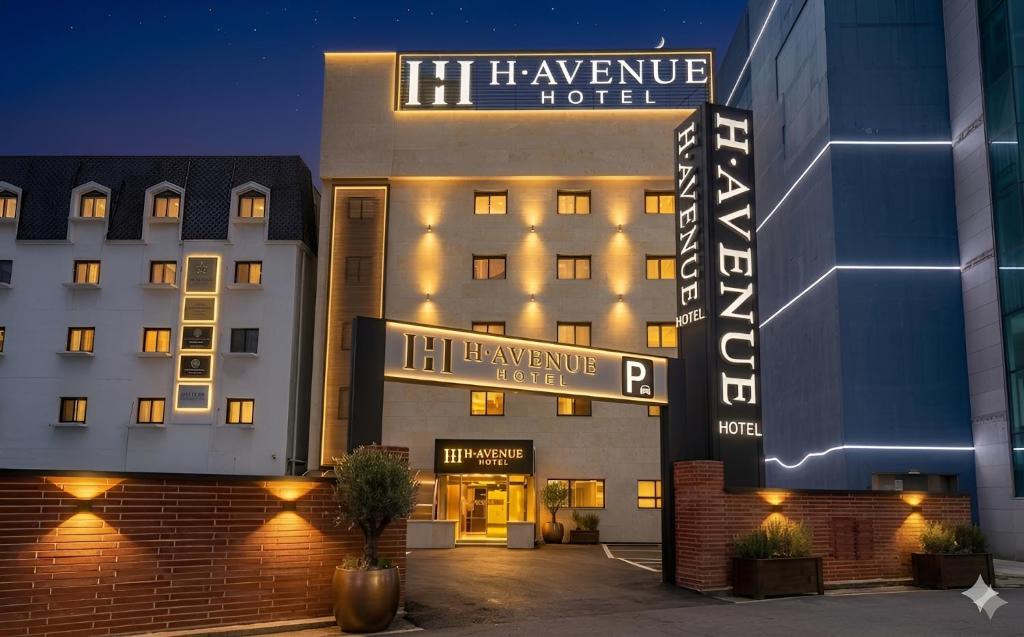 a hotel with a sign on the front of it at H Avenue Hotel Gyeryong Eomsa branch in Gyeryong