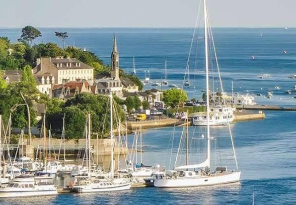 a group of boats docked in a harbor at Maison à proximité des plages in Bénodet