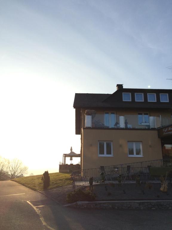 a large house on the side of a road at Business Apartments Höfle in Heppenheim an der Bergstrasse
