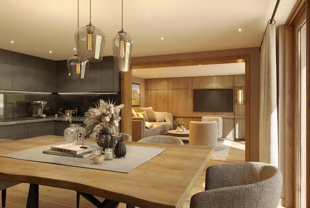 a dining room and living room with a table and chairs at Edelweiss Apartments in Lech am Arlberg