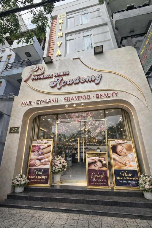 a store front of a beauty shop with pictures of babies at Nhà nghỉ KIM VÀNG in Phú Quốc