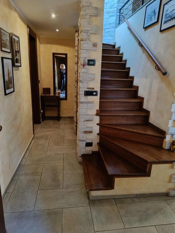 a staircase in a house with wood and tile floors at Appartamento Luigia House in Cornaredo