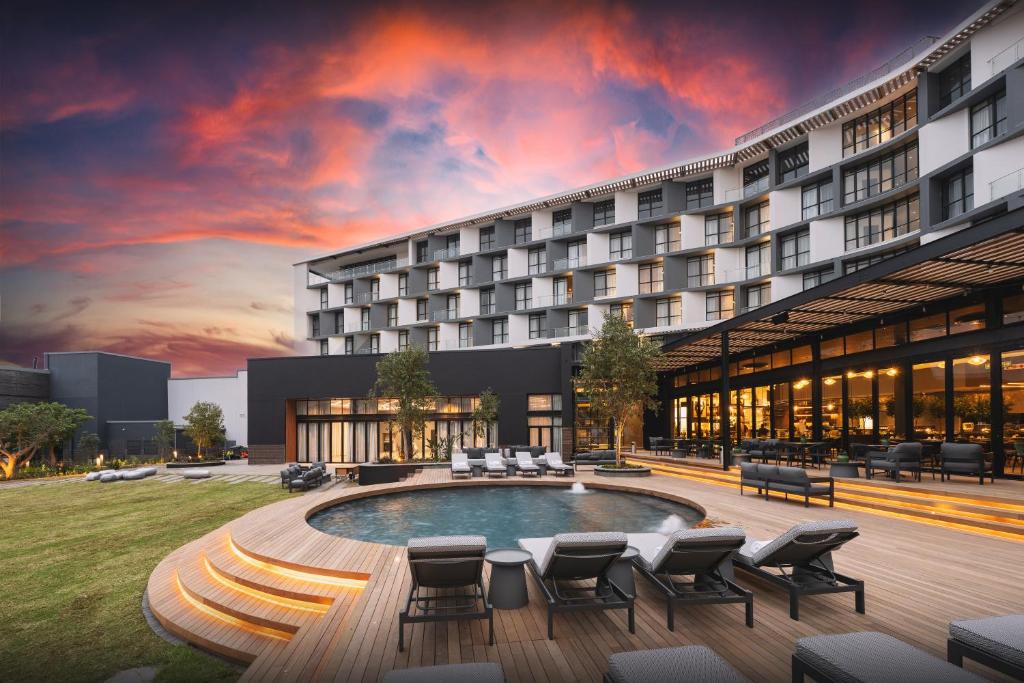 a rendering of a hotel building with a pool at The Capital Boardwalk in Gqeberha