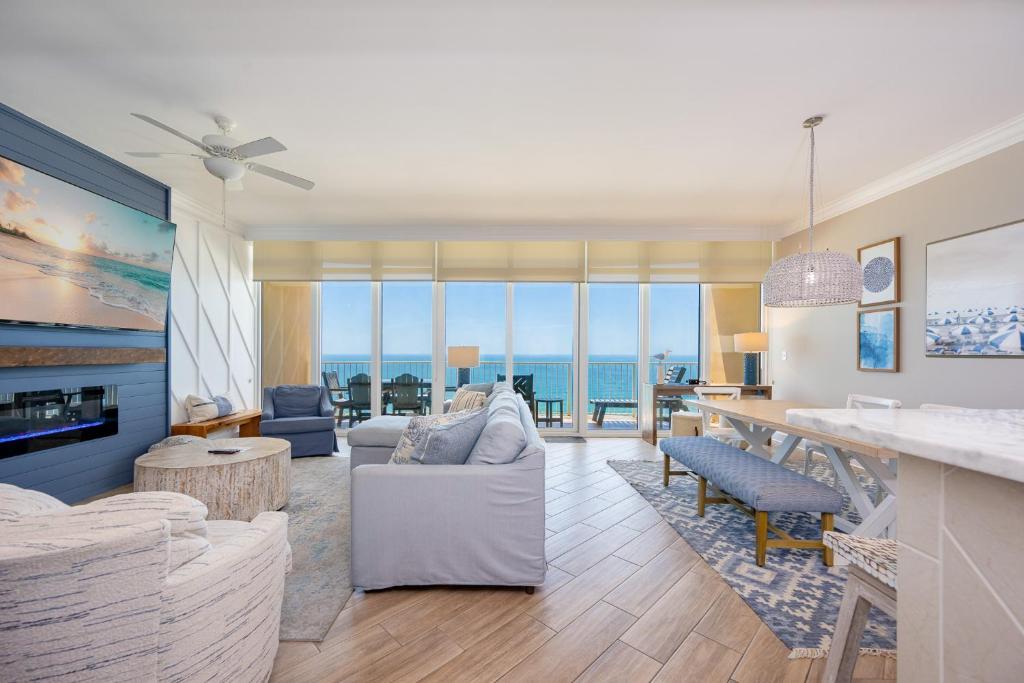 a living room with a view of the ocean at Phoenix Orange Beach II 2103 in Orange Beach