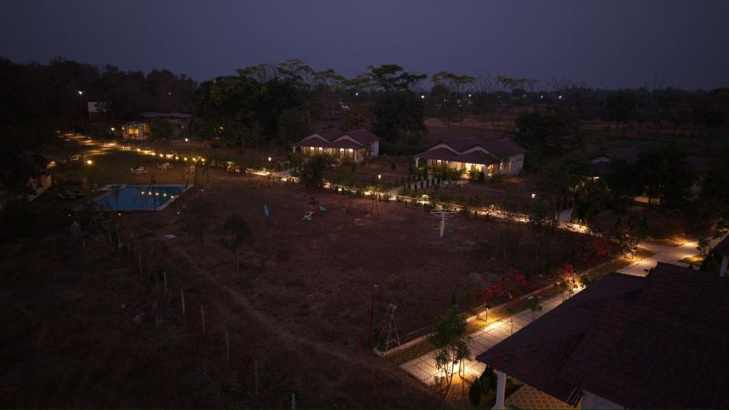 an overhead view of a resort with a pool at night at Tuli Orchid - A Boutique Eco Resort in Rāmtek