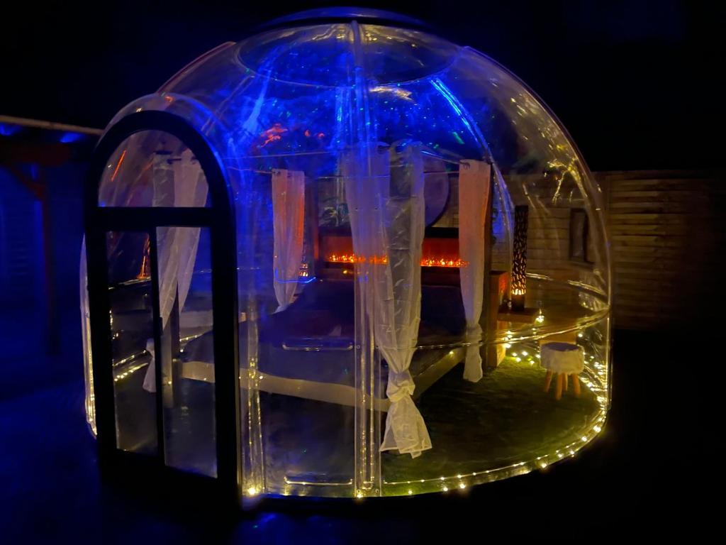a plastic igloo with a house in it with lights at Bubble-Hotel Deutschland in Orlenbach