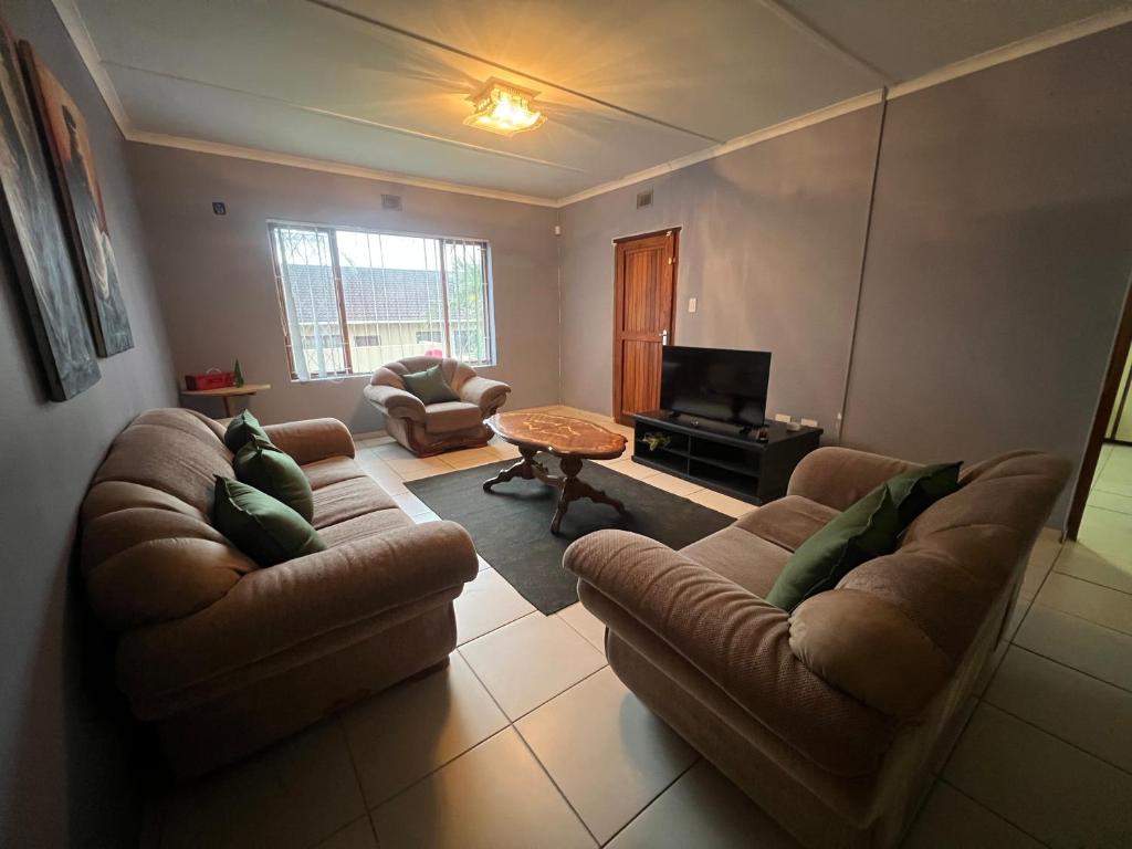 a living room with two couches and a television at Prime Leisure in Margate