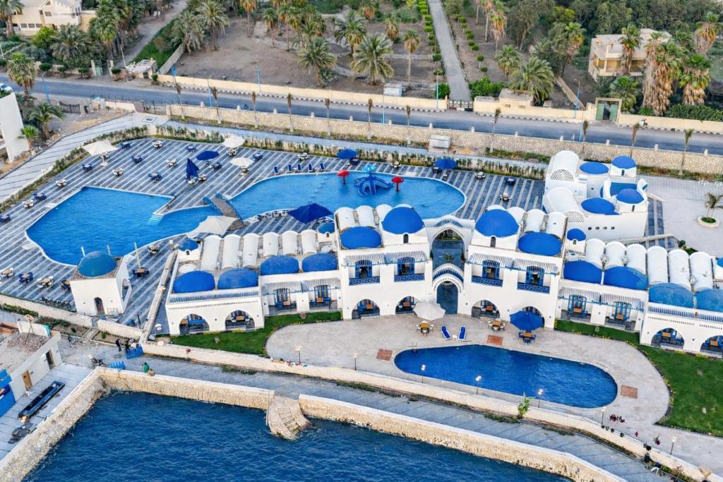 an aerial view of a resort with two pools at New Panorama Resort in Fayoum