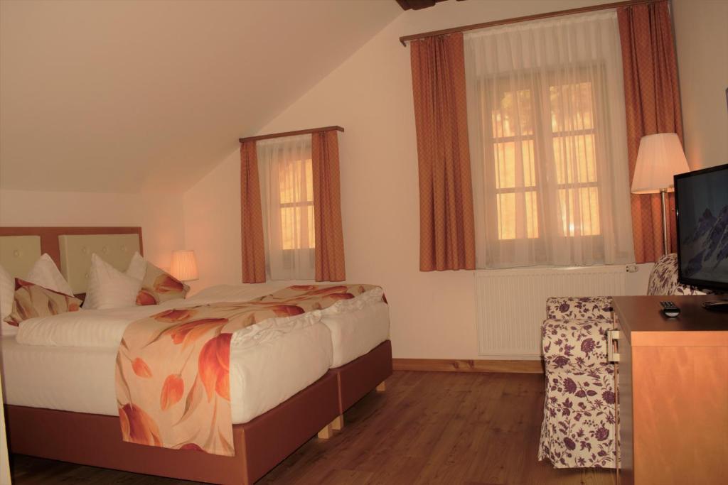 Postel nebo postele na pokoji v ubytování Villa Frischmuth am See