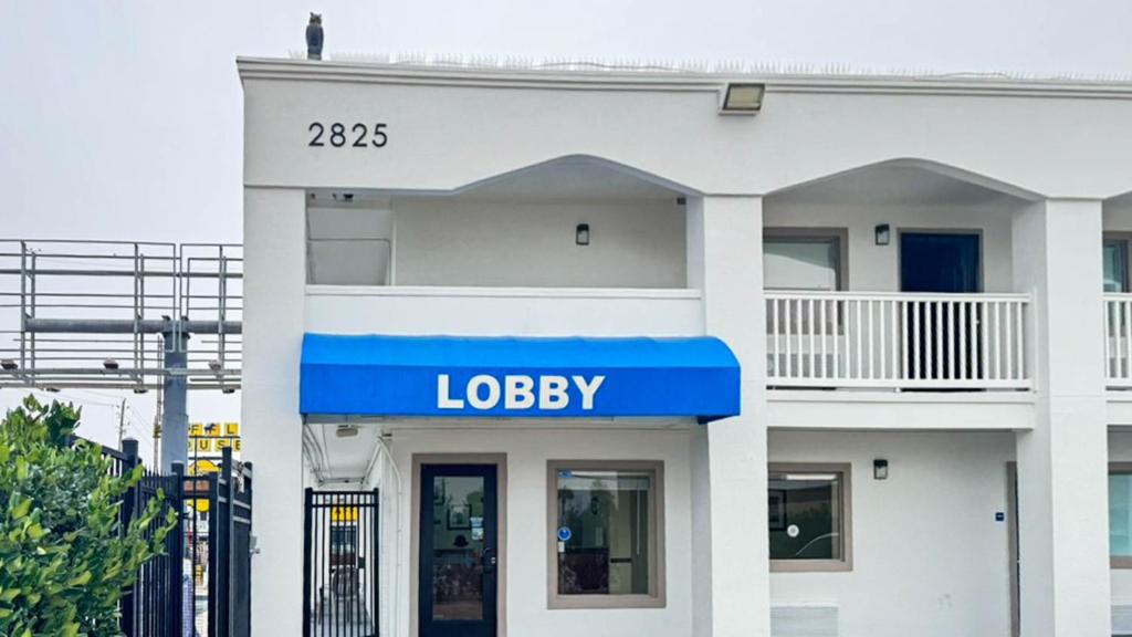 a building with a sign that reads lobbey at Motel 6 Classic Galveston, TX Beach-Seawall in Galveston