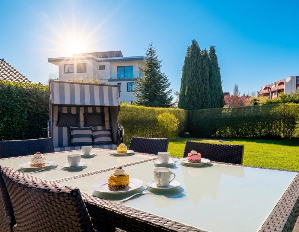a table with cakes sitting on top of it at 1006 - Haus Seesternweg in Dahme