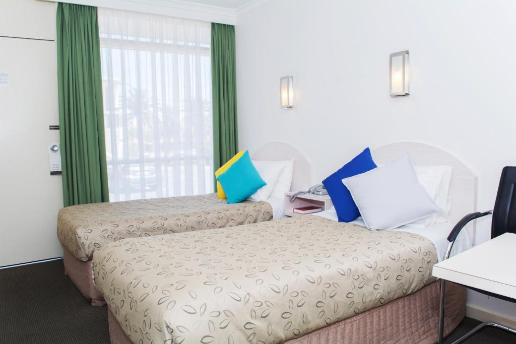 Postel nebo postele na pokoji v ubytování Alexander Motor Inn