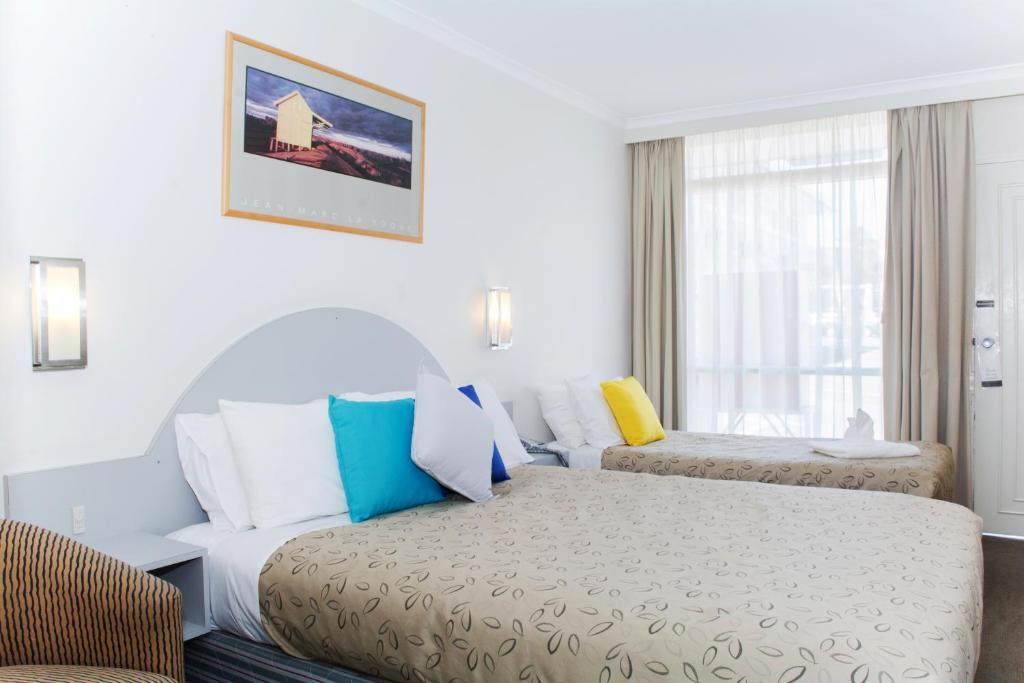 Postel nebo postele na pokoji v ubytování Alexander Motor Inn