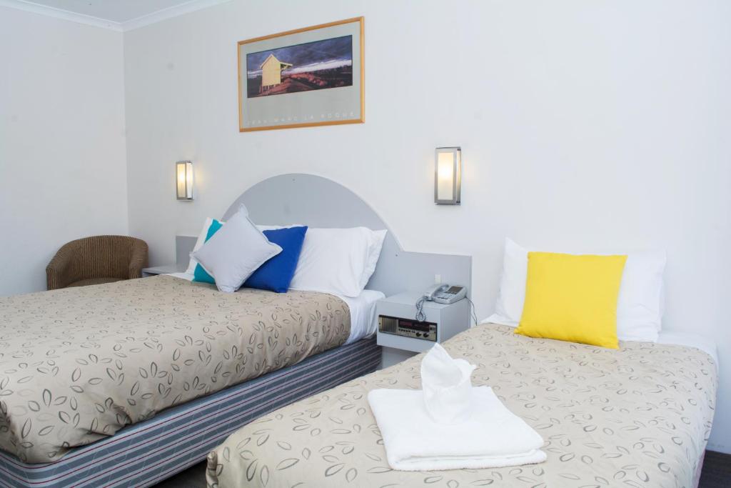 Postel nebo postele na pokoji v ubytování Alexander Motor Inn
