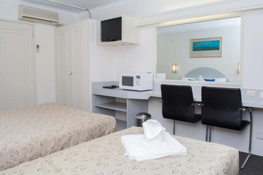 Postel nebo postele na pokoji v ubytování Alexander Motor Inn