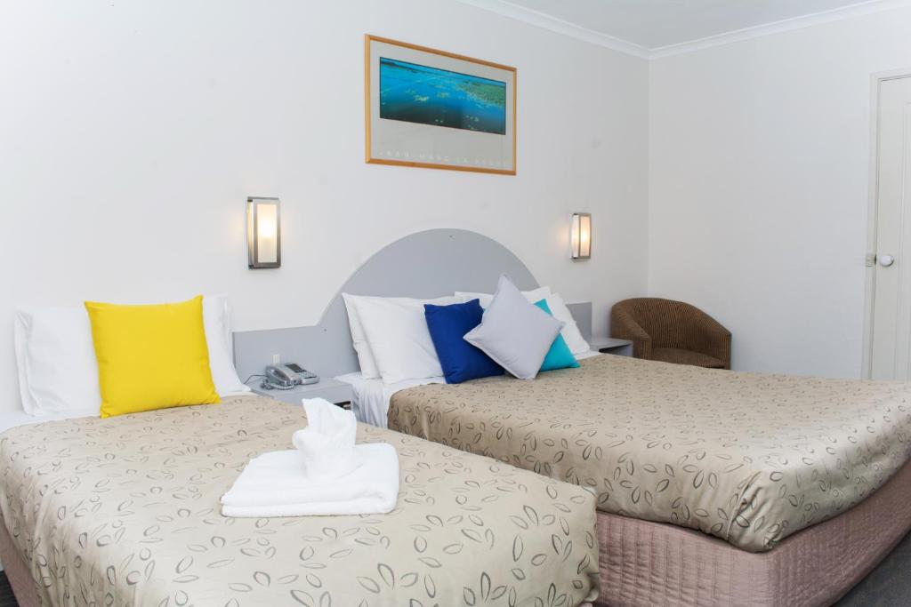 Postel nebo postele na pokoji v ubytování Alexander Motor Inn